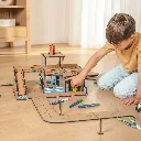 Children_Lifestyle_Photos_A_young_boy_plays_with_a_cardboard_police_station_CP7Vhiqu.webp